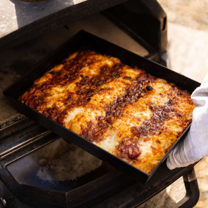 UK Detroit-style Pizza with beans and cheese in an Ooni Detroit-style Pizza Pan coming out of an Ooni Karu 16.