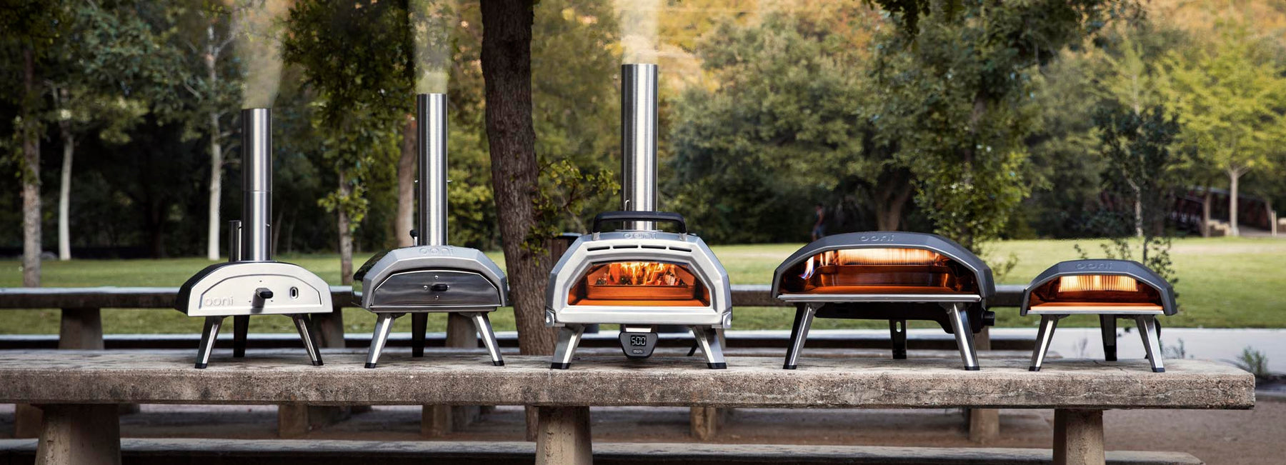 Collection of Ooni pizza ovens including Ooni Karu 16 pizza oven, Ooni Koda 16 pizza oven and Ooni Fyra 12 pizza oven