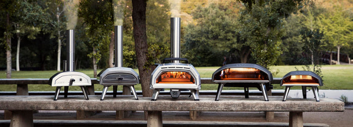 Collection of Ooni pizza ovens including Ooni Karu 16 pizza oven, Ooni Koda 16 pizza oven and Ooni Fyra 12 pizza oven